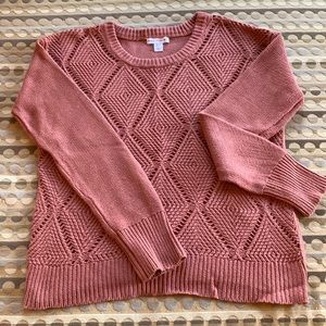 Terra Cotta in color. Loose weave, light weight with split hem, never worn.